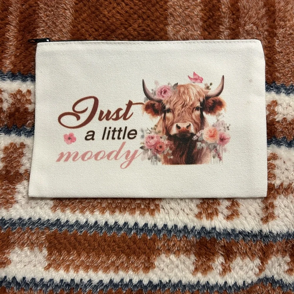**2/$10** Moody Cow Print Pouch
